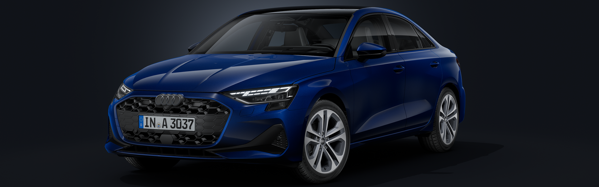 Kék Audi A3 Limousine egy sötét háttér előtt
